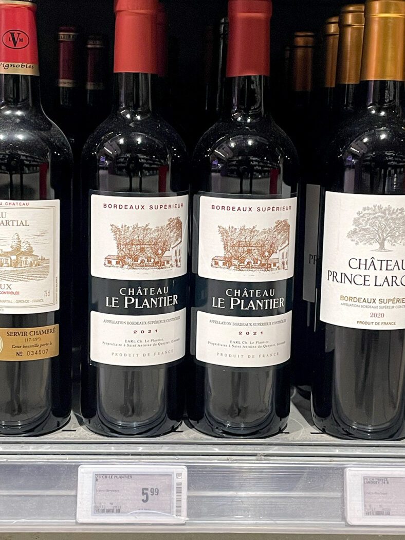 bottles of wine on the supermarket shelf