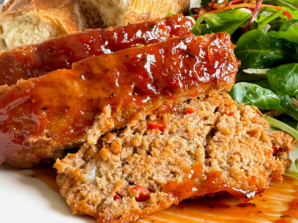 A closeup of homemade meatloaf on a plate 