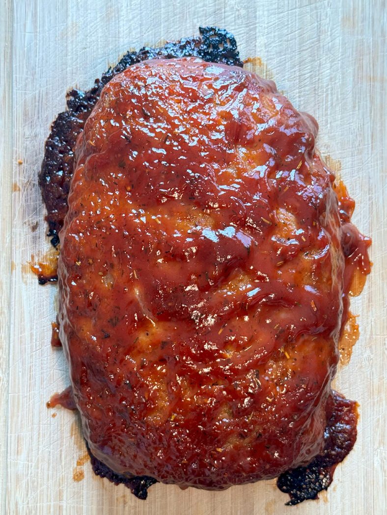 Glazed meatloaf on a cutting board
