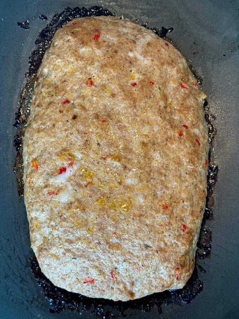 Cooked meatloaf on a baking tray